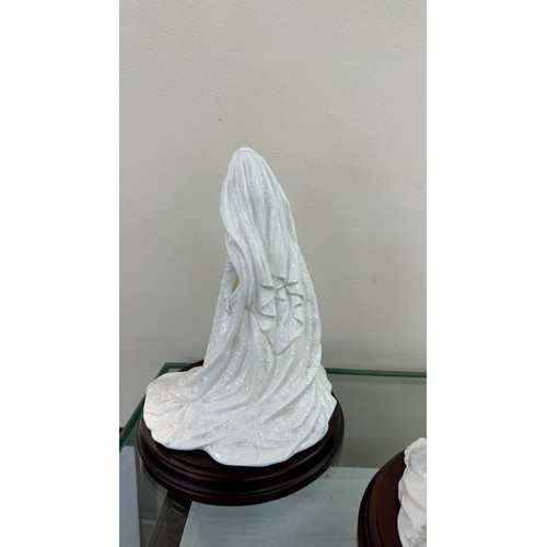585 - Two Coalport lady bride figurines ' The Queen' and ' Queen Mary' both on wooden plinths, approximate... 