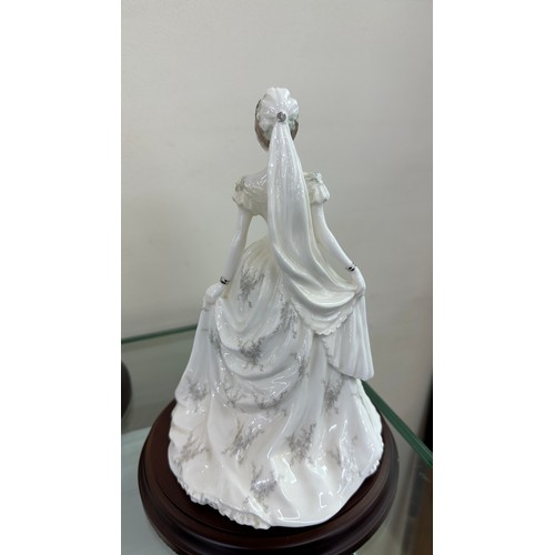 585 - Two Coalport lady bride figurines ' The Queen' and ' Queen Mary' both on wooden plinths, approximate... 