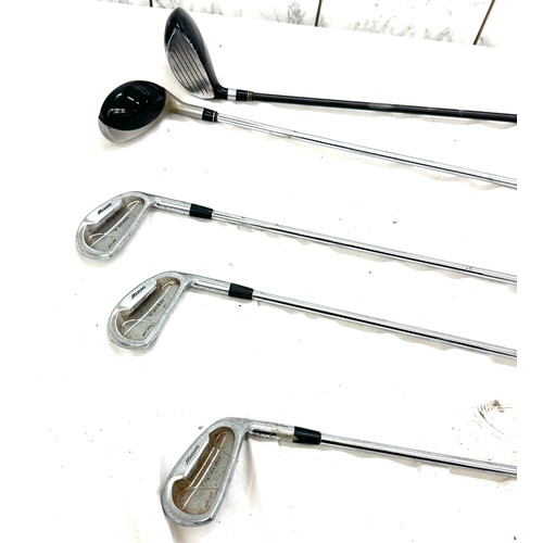 212 - Selection of assorted golf clubs and bag