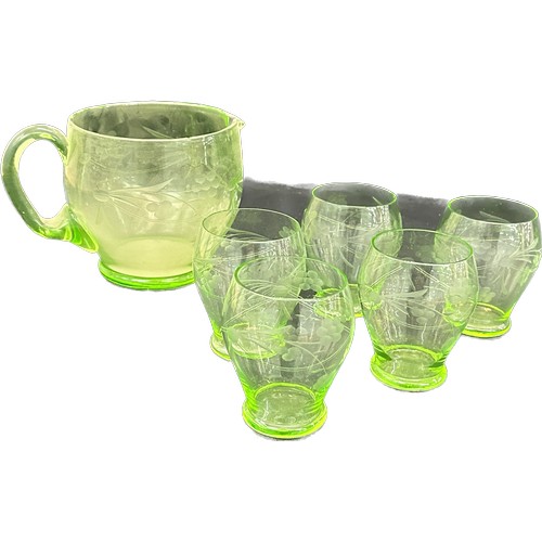 131 - Selection of five matching green uranium glasses and a matching jug