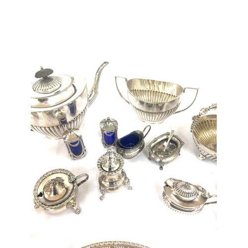 129 - Selection of silver plated items includes pepper pots etc