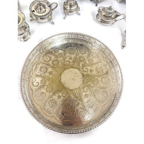 129 - Selection of silver plated items includes pepper pots etc