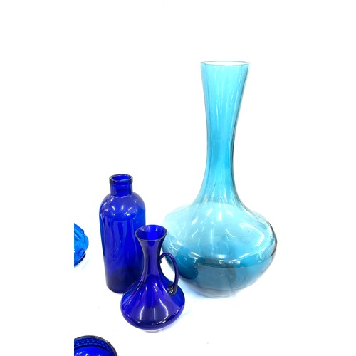 202 - Selection of Blue glassware includes Vases, duck, decanters etc tallest vase measures 21 inches tall