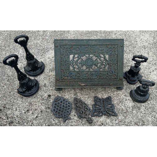 101D - Metal Lectern, 4 door stops ( includes pair marked Kenrick) and 3 trivets