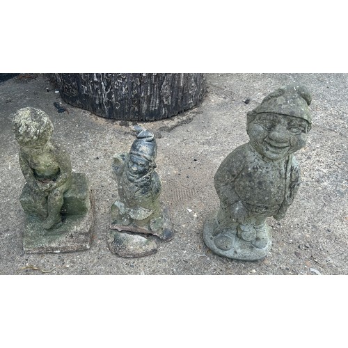 101C - 3 Concrete garden ornaments to gnomes and a boy on a wall, largest measures approximately 16 inches ... 