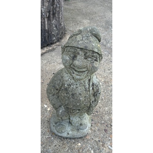 101C - 3 Concrete garden ornaments to gnomes and a boy on a wall, largest measures approximately 16 inches ... 
