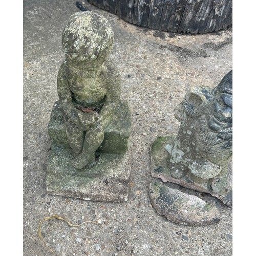 101C - 3 Concrete garden ornaments to gnomes and a boy on a wall, largest measures approximately 16 inches ... 