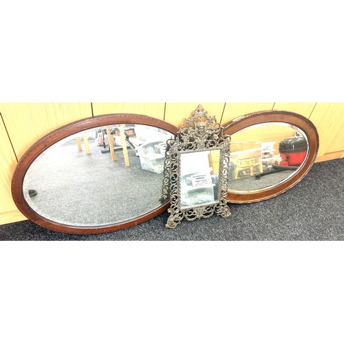 107 - 2 Oval framed mirrors and one other largest measures approximately 33 x 22 inches
