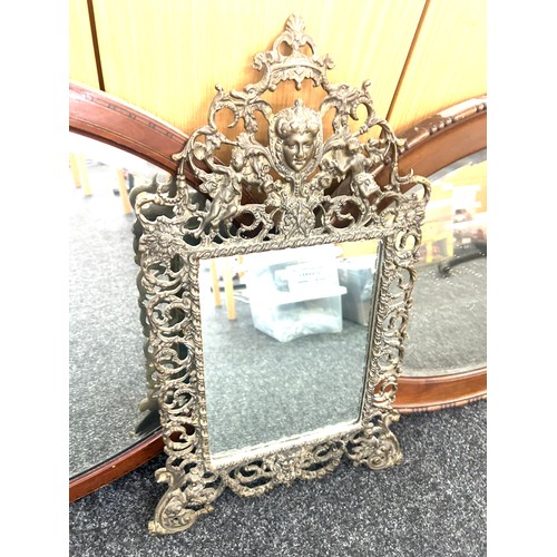 107 - 2 Oval framed mirrors and one other largest measures approximately 33 x 22 inches
