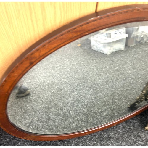 107 - 2 Oval framed mirrors and one other largest measures approximately 33 x 22 inches