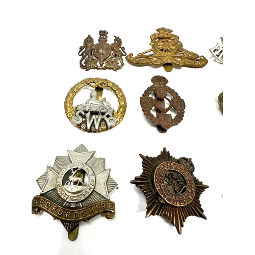 303 - 12 military cap badges