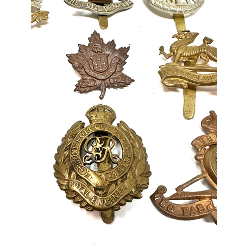 326 - 9 military cap badges