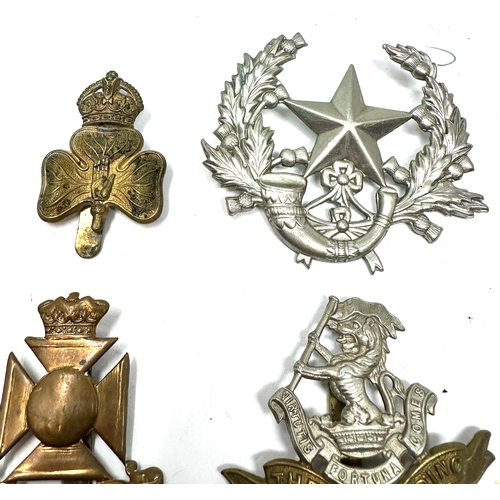 329 - 9 military cap badges
