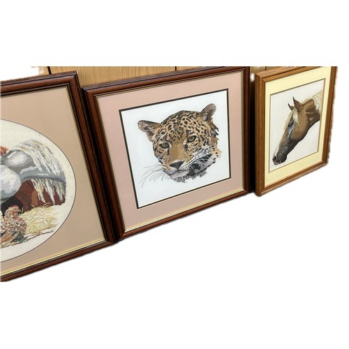 96 - Four framed tapestries depicting animals, dogs, horses, etc largest measures approximately 21 inches... 