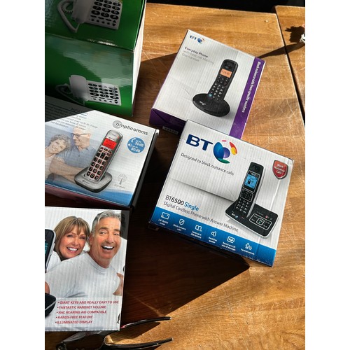 124 - Selection of boxed electrical items to include a bladeless fan, fan heaters, landline phones, body m... 