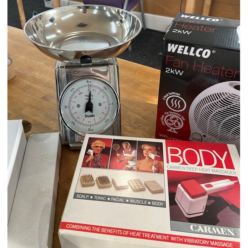 124 - Selection of boxed electrical items to include a bladeless fan, fan heaters, landline phones, body m... 