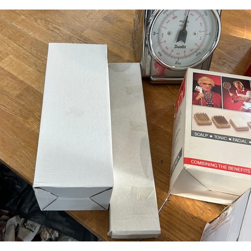 124 - Selection of boxed electrical items to include a bladeless fan, fan heaters, landline phones, body m... 