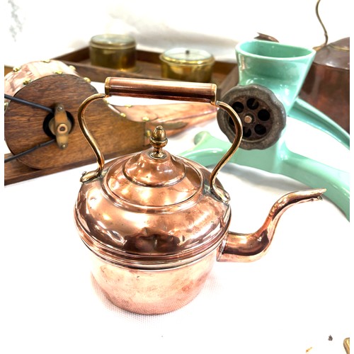 141 - Selection of metalware to include brass and copper ware to include kettles, barometer, enamel mincer... 