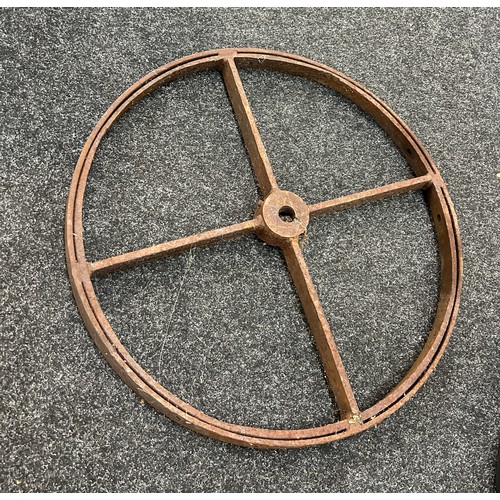100E - Vintage cast iron wheel measures approximately 23 inches diameter