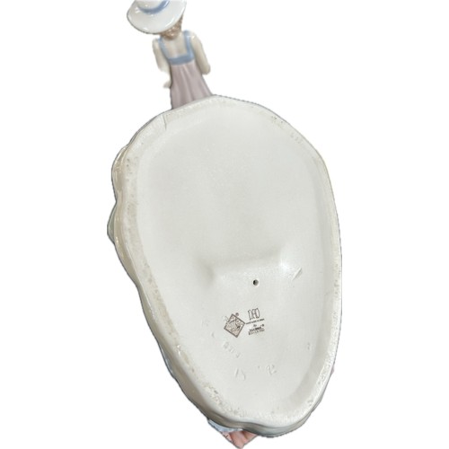 102 - Three vintage porcelain figurines one Royal Doulton, two Nao, tallest measures approximately: 10 inc... 