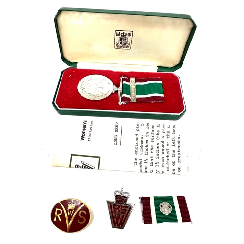 384 - Boxed Women's Royal Voluntary Service (WRVS) medal and badges set. 
The set includes the full-size W... 