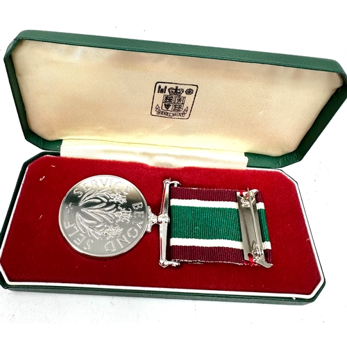 384 - Boxed Women's Royal Voluntary Service (WRVS) medal and badges set. 
The set includes the full-size W... 