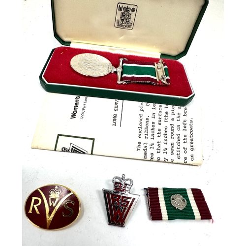 384 - Boxed Women's Royal Voluntary Service (WRVS) medal and badges set. 
The set includes the full-size W... 