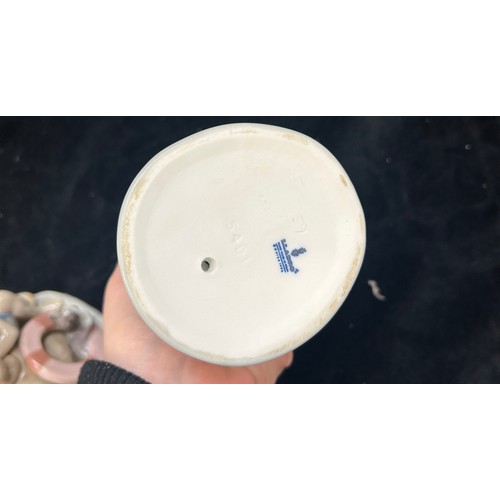 469 - Vintage Lladro Mondays child 6011 figurine and a Lladro porcelain figure of a boy sitting on a tree ... 