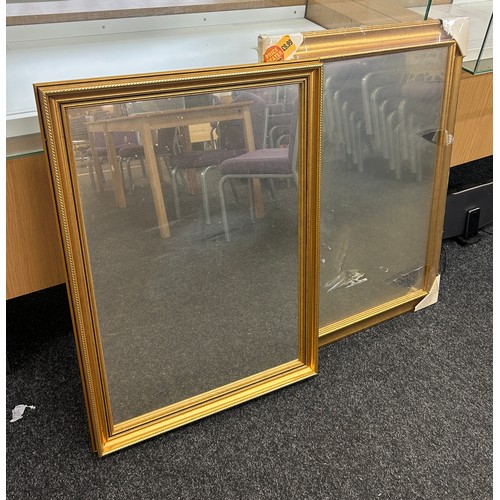 187 - Two gold framed wall hanging mirrors largest measures approximately: 25 x 35 inches