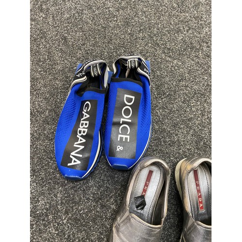 199 - Two pairs of Dolce and Gabbana trainers and a pair of Prada shoes.