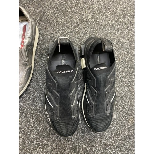 199 - Two pairs of Dolce and Gabbana trainers and a pair of Prada shoes.
