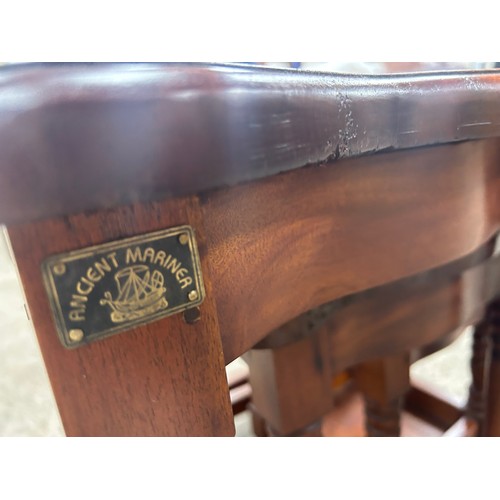 393 - Mahogany nest of three tables maker Ancient Marinea largest measures approximately: 22 inches tall x... 