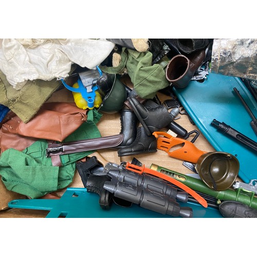 303 - Large lot of vintage action man clothes and accessories to include boots, weapons etc
