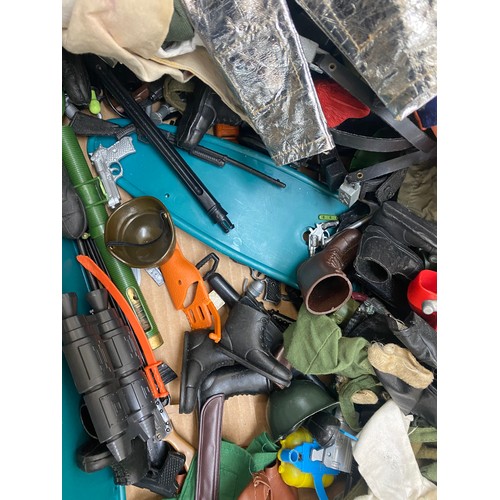 303 - Large lot of vintage action man clothes and accessories to include boots, weapons etc