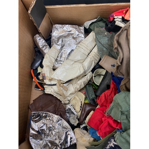 303 - Large lot of vintage action man clothes and accessories to include boots, weapons etc
