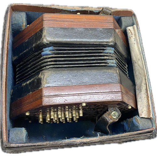 563 - A good antique 48 button concertina possibly Lachenal serial no 4412, with steel reeds, in original ... 