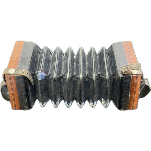 563 - A good antique 48 button concertina possibly Lachenal serial no 4412, with steel reeds, in original ... 