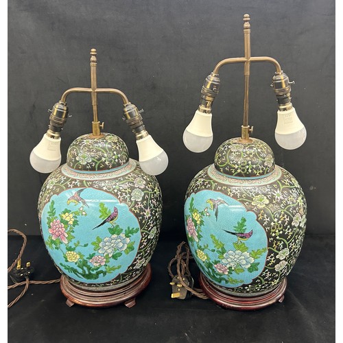 217 - Pair vintage Chinese porcelain vase table lamps on wooden stands , in famille rose style, both have ... 