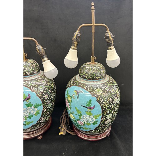 217 - Pair vintage Chinese porcelain vase table lamps on wooden stands , in famille rose style, both have ... 