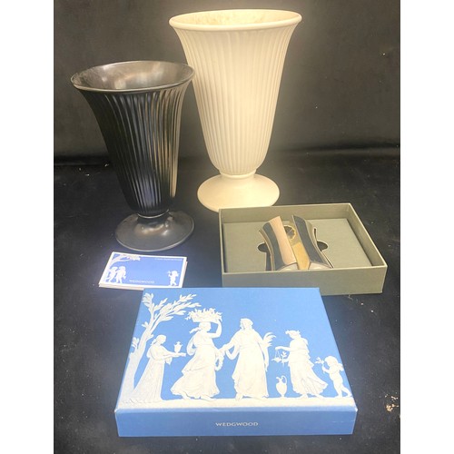 180 - Three pieces of Wedgwood includes salt and pepper, vases etc