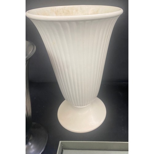 180 - Three pieces of Wedgwood includes salt and pepper, vases etc