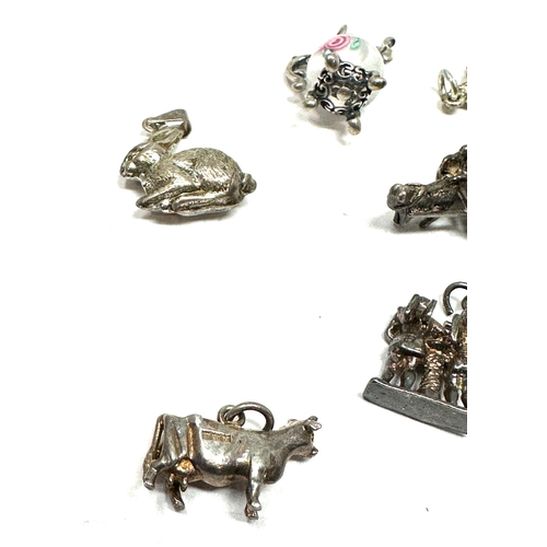 54 - 10 vintage silver charms weight 27g
