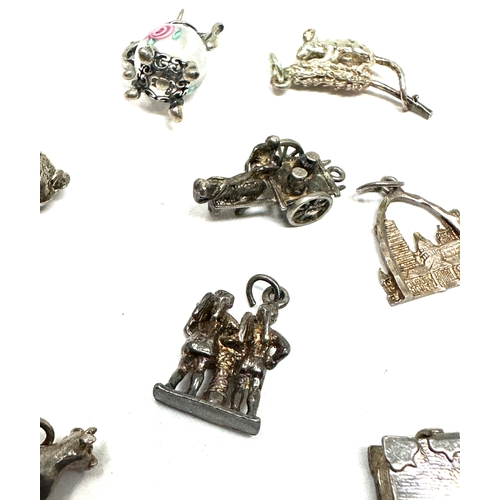 54 - 10 vintage silver charms weight 27g