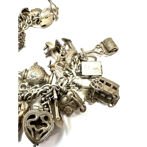 59 - Large heavy silver charm bracelet & charms weight 138g