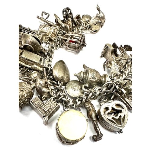 59 - Large heavy silver charm bracelet & charms weight 138g
