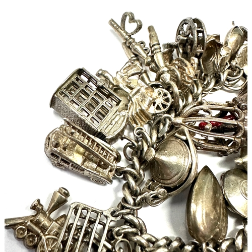 59 - Large heavy silver charm bracelet & charms weight 138g