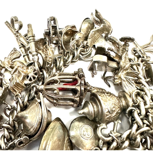 59 - Large heavy silver charm bracelet & charms weight 138g