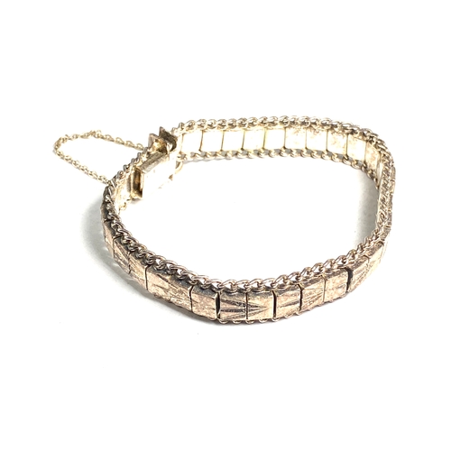 180 - Vintage Silver link bracelet featuring a textured, geometric design and a safety chain Weight 37g