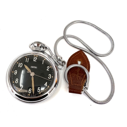 508 - vintage Smiths pocket watch featuring a black dial with white Arabic numerals and a silver-toned met... 