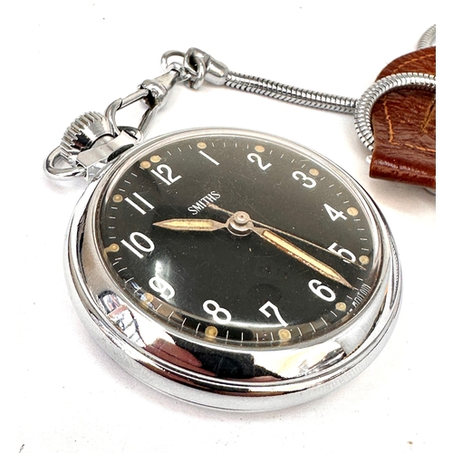 508 - vintage Smiths pocket watch featuring a black dial with white Arabic numerals and a silver-toned met... 